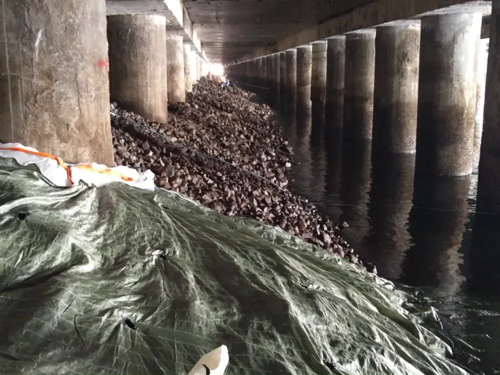 Bespoke fabric envelope being installed beneath a quay